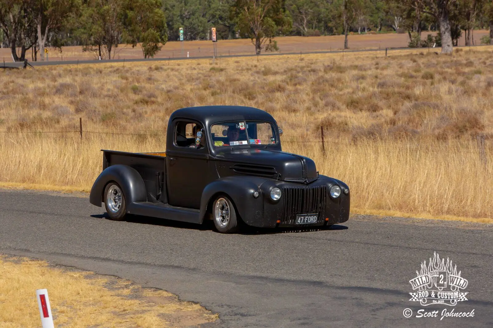 Black Ford pickup truck cruising